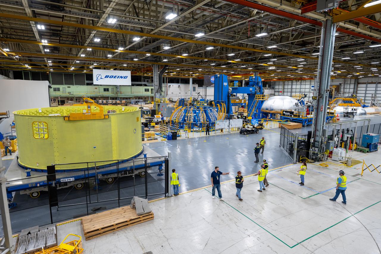Crews at NASA’s Michoud Assembly Facility in New Orleans move the forward skirt of NASA’s Space Launch System (SLS) rocket to another part of the facility Dec. 15. Teams are preparing to apply the thermal protection system to the flight hardware, which will protect it from the extreme temperatures during launch and flight. The forward skirt is part of the core stage that will power the SLS rocket for the Artemis III mission. The forward skirt houses flight computers, cameras, and avionics.. The SLS core stage is made up of five unique elements: the forward skirt, liquid oxygen tank, intertank, liquid hydrogen tank, and the engine section. When fully stacked, the forward skirt is located at the top of the core stage and connects the stage to the upper part of the rocket. Together with its four RS-25 engines, the rocket’s massive 212-foot-tall core stage — the largest stage NASA has ever built — and its twin solid rocket boosters produce 8.8 million pounds of thrust to send NASA’s Orion spacecraft, astronauts and supplies beyond Earth’s orbit to the Moon and, ultimately, Mars. Offering more payload mass, volume capability and energy to speed missions through space, the SLS rocket, along with NASA’s Gateway in lunar orbit, the Human Landing System, and Orion spacecraft, is part of NASA’s backbone for deep space exploration and the Artemis lunar program. No other rocket is capable of carrying astronauts in Orion around the Moon in a single mission.